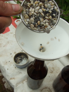 Shake small stones and water to clean really dirty bottles.