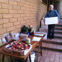 Vote with your money Su Dennett prepares boxed veggies for pick-up along with a range of regionally sourced bulk foods
