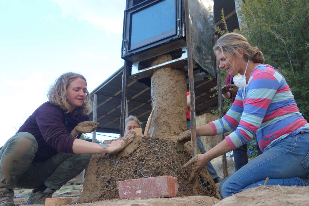 A rocket conversion on a conventional oven - January 2017 Permaculture Calendar feature.